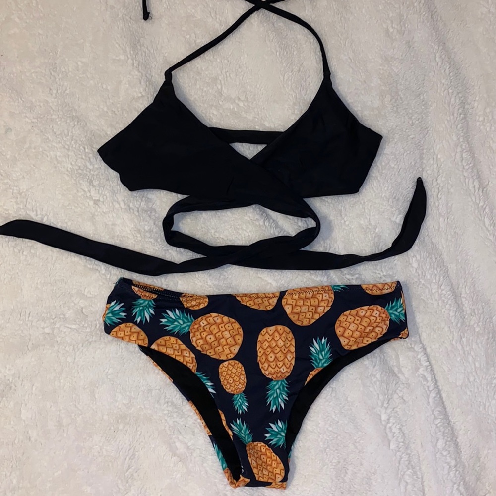 Black cross over bikini with pineapple bottoms